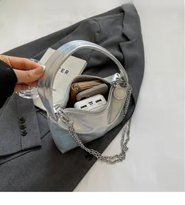 Interior view of silver hobo bag showing large capacity for phone and wallet