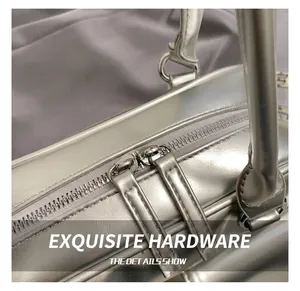 Detail showing metallic silver leather texture and premium dual zipper closure system