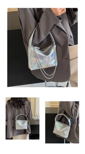 Three-way view of holographic silver underarm bag with chain and top handle