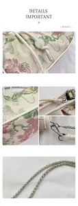 Detailed view of floral jacquard fabric with cream leather trim and silver chain strap