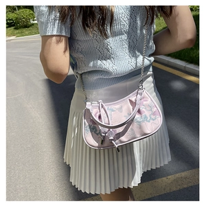 Detail of light purple crescent bag with traditional Chinese floral embroidery and chain