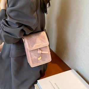 Pink matte leather crossbody square bag for women with minimalist metal pendant detail