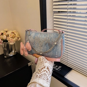 Blue denim underarm bag with silver sequins, pink leather trim and a cute rabbit charm