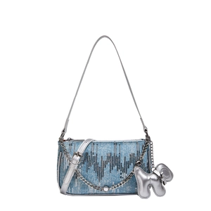 Y2K style light blue denim shoulder bag with silver sequins and a 3D dog pendant