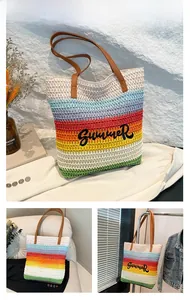 Detail of colorful rainbow woven tote bag with Summer embroidery and brown leather handles