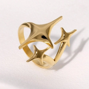 Gold stainless steel open ring featuring three minimalist 3D star charms on white background