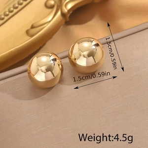 Polished gold stainless steel sphere stud earrings with 1.5cm diameter on a warm backdrop