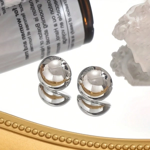 Minimalist silver stainless steel spherical stud earrings with a high mirror polish finish