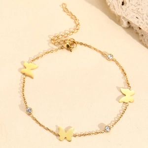 Elegant gold titanium bracelet featuring delicate butterfly charms and zircon accents
