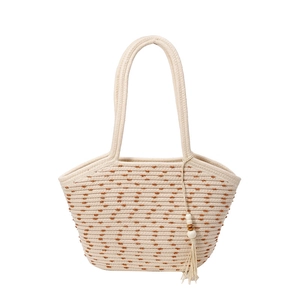 Minimalist woven straw tote bag with brown polka dots and wooden bead tassel
