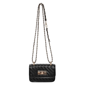 Classic black quilted leather crossbody bag with gold chain strap and rotary metal lock