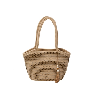 Minimalist straw tote bag with black stripes and decorative beaded tassel pendant