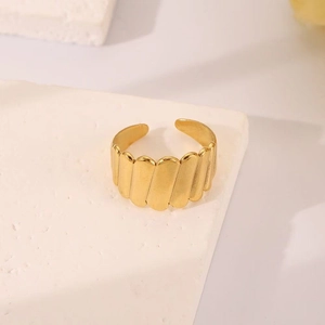 18K gold plated snake-style open ring with vertical wave texture on stone stand