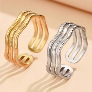 Three-layer wavy open ring in gold and silver finish with handcrafted hammered texture