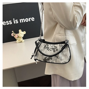 Detail of Chinese style ink print handbag with embroidery and silver chain strap