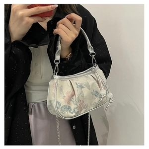 Detail view of New Chinese style embroidered handbag with floral and bird jacquard fabric