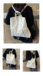 Detailed view of white pleated backpack with bow details and versatile straps