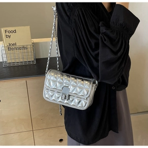 Silver quilted chain bag shown on a model for a stylish daily outfit look