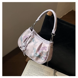 Detailed view of a Neo-Chinese embroidered handbag with elegant floral patterns.