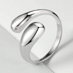 Minimalist silver open ring featuring a double teardrop design with polished finish