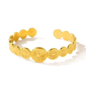 Polished gold stainless steel cuff bracelet with sunburst engraving and retro design