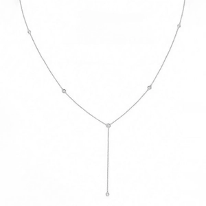 Close-up of a minimalist Y-shaped necklace with five bezel-set round zircon gemstones