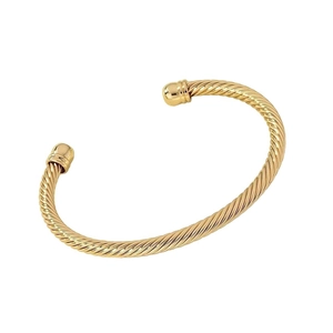 Minimalist gold twisted cable open cuff bracelet with spherical ends in a sleek design