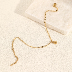 Minimalist gold stainless steel anklet featuring flat link chain and polished bead pendant