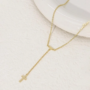Elegant gold stainless steel Y-shaped necklace featuring heart link and cross pendant