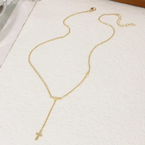 Golden stainless steel Y-shaped necklace featuring dual cross pendants and adjustable chain