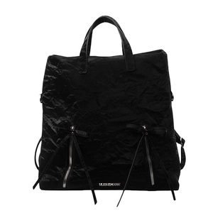 Versatile black PU crossbody backpack with pleated texture and vertical zippers