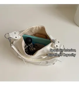 Interior view showing the large capacity of the white pleated leather bucket bag
