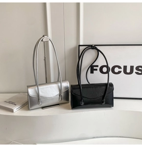 Minimalist long-strap shoulder bags in metallic silver and glossy black leather