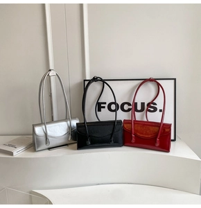 Three elegant rectangular leather shoulder bags shown in silver, black and vibrant red colors