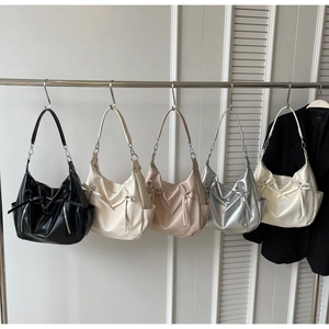 Detailed display of fashionable hobo buckets in five colors with bow drawstring details