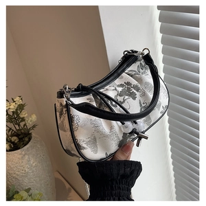 Detailed embroidery of cranes and pine trees on a white Chinese style handbag