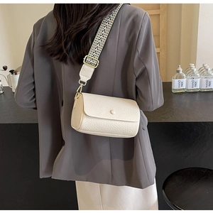 Litchi pattern cream shoulder bag with stylish jacquard woven wide strap and gold hardware