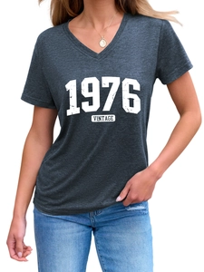 Detail of V-neck short sleeve T-shirt with vintage 1976 print in marl gray fabric