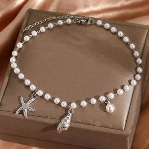 Ocean themed stainless steel anklet with faux pearls, starfish and seashell charms