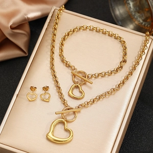 Golden stainless steel jewelry set with hollow heart pendants and OT toggle clasp