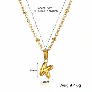 Size diagram of gold letter K pendant necklace showing 47+5cm chain length and dimensions