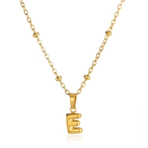 Detailed view of a 3D gold letter E pendant on a decorative beaded cable chain