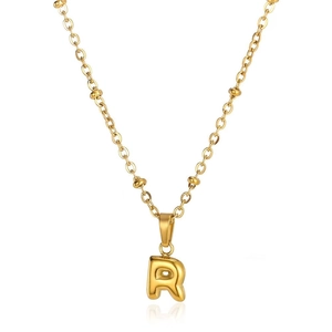 Detail of a 3D gold initial R pendant with beaded chain on white background