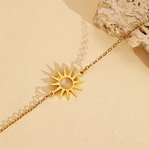 Minimalist gold stainless steel sun pendant bracelet with elegant solar ray cutout design