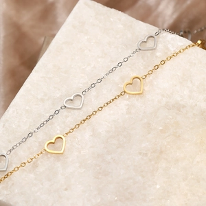 Elegant gold and silver stainless steel anklet featuring three minimalist hollow hearts