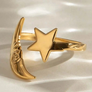 Polished gold stainless steel open ring featuring vintage star and moon celestial motifs
