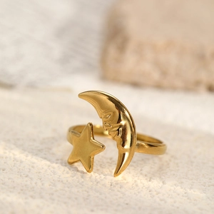 Macro shot of gold vintage crescent moon and star adjustable stainless steel ring detail