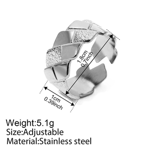 Detailed view of adjustable silver stainless steel ring with textured wave pattern