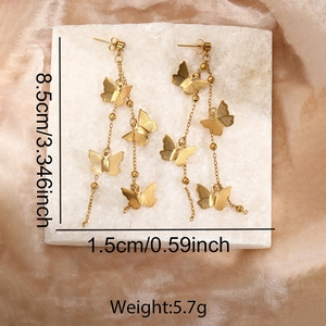 Detail shot of golden double-layer butterfly tassel earrings with 8.5cm length dimensions