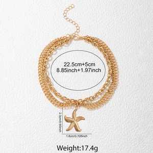 Gold layered stainless steel anklet with a textured starfish pendant and triple chains